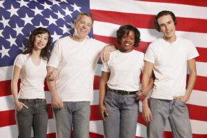 People in front of American flag.