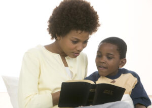 Mother and Son Reading Bible Together.